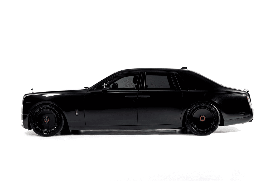 Black Rolls-Royce Phantom in side profile against a white studio sweep